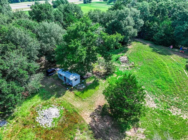 a view of a chair and table on the garden