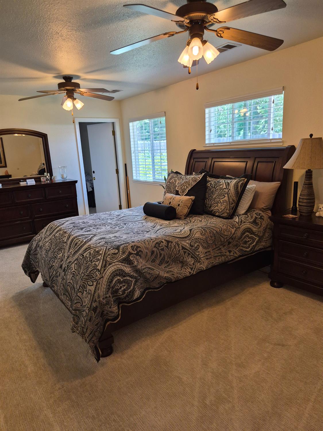 5817 Keyntel Street Citrus Heights, CA 95621 - Photo 9 of 30 a bedroom with a bed and a chandelier