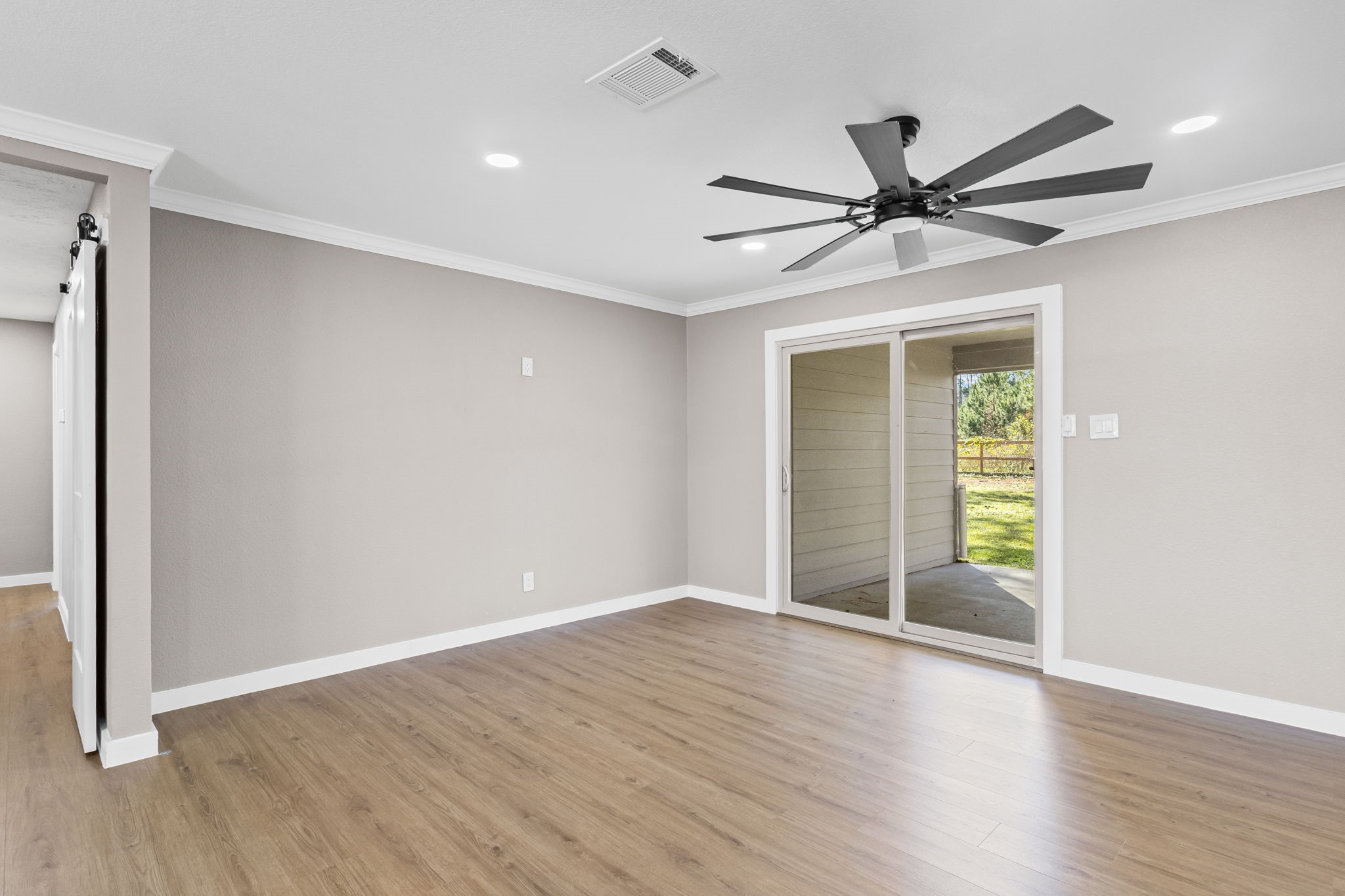 44271 Highway 105 Hull, TX 77564 - Photo 15 of 38 a view of a big room with wooden floor closet and windows