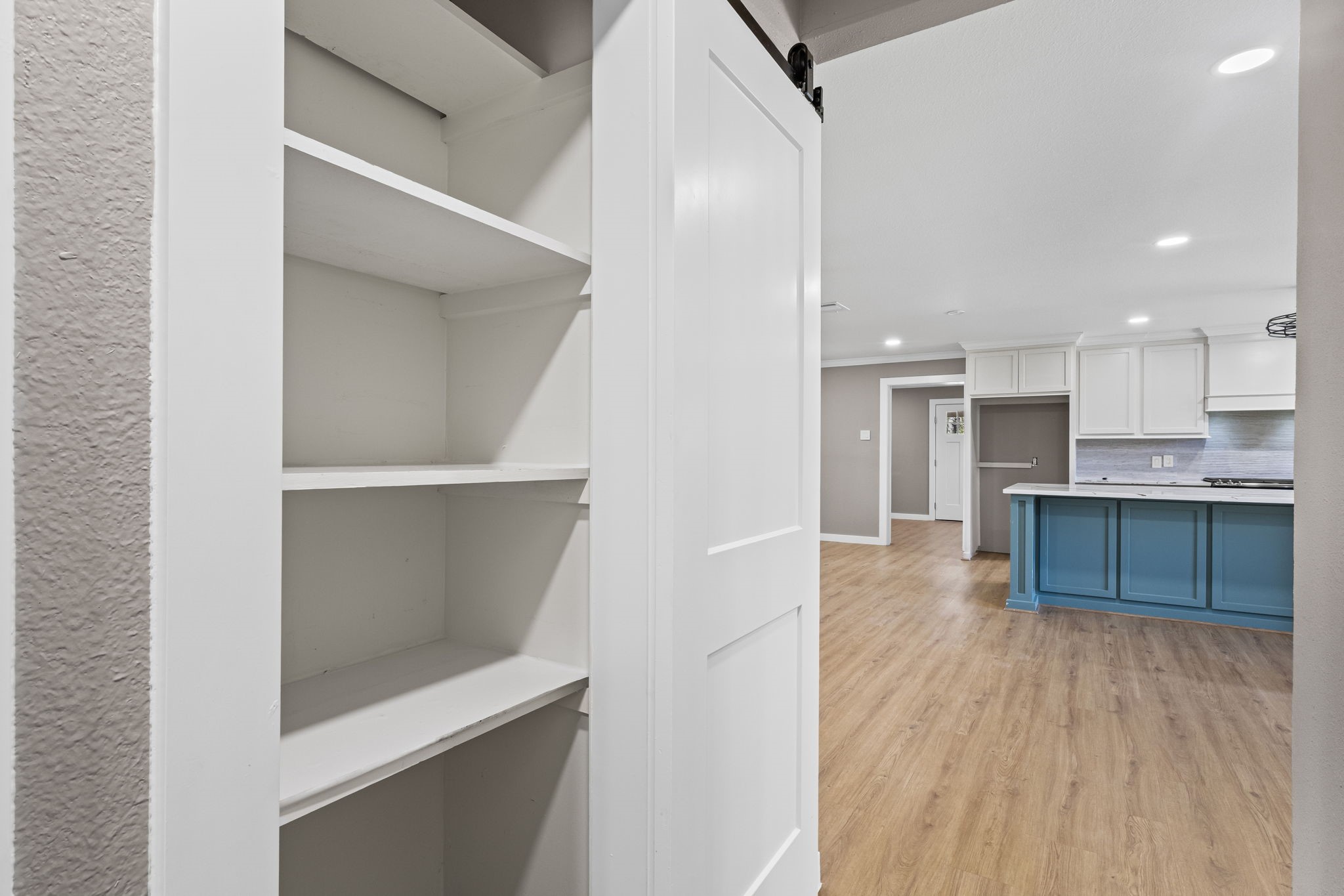 44271 Highway 105 Hull, TX 77564 - Photo 16 of 38 a view of kitchen with wooden floor and electronic appliances
