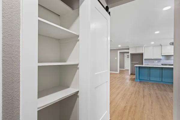 a kitchen with a refrigerator and a sink