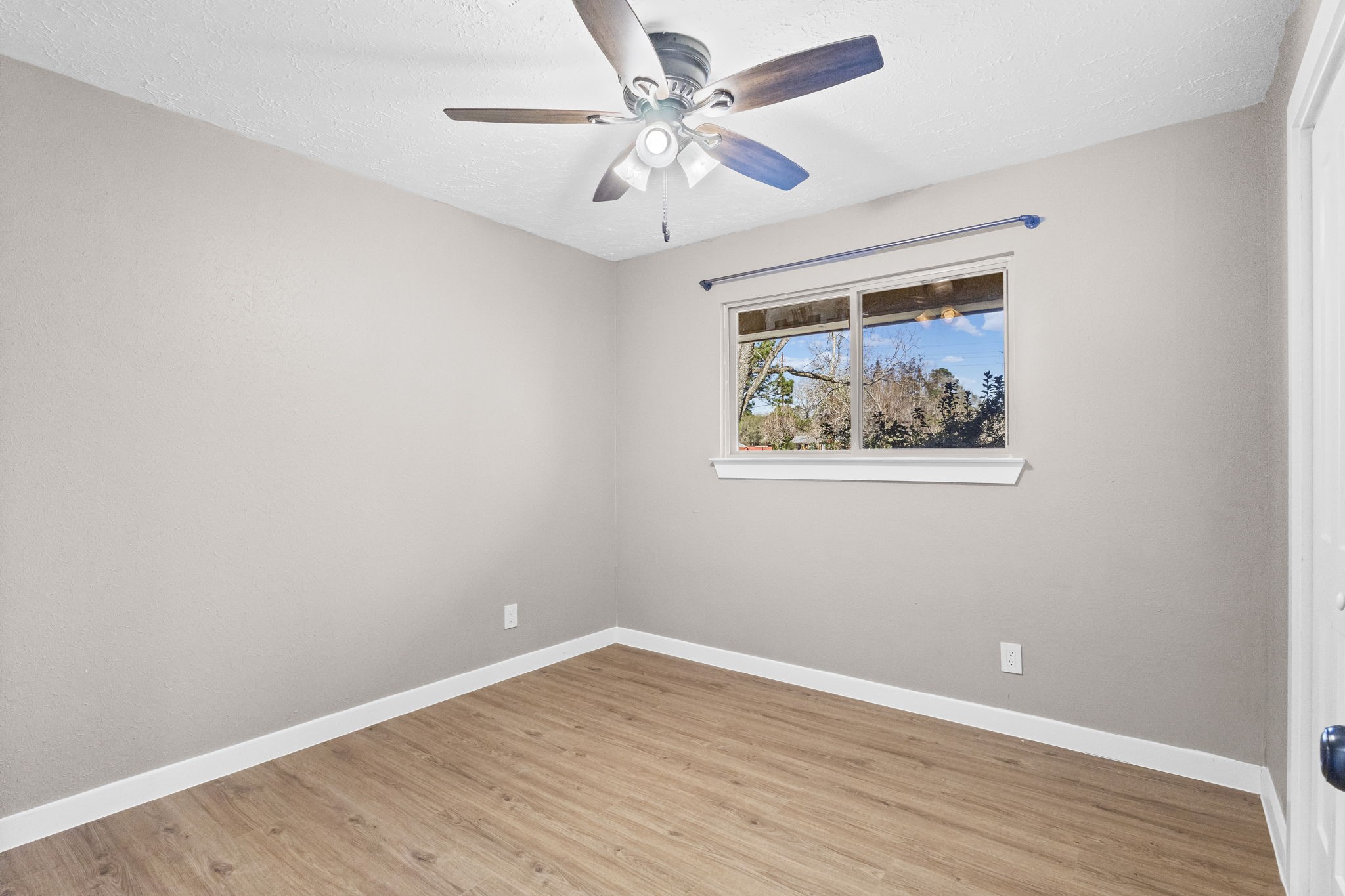 44271 Highway 105 Hull, TX 77564 - Photo 23 of 38 a view of an empty room with wooden floor