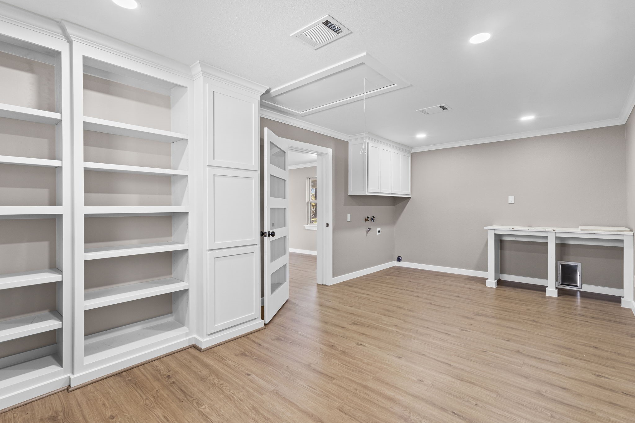 44271 Highway 105 Hull, TX 77564 - Photo 27 of 38 a view of a kitchen with wooden floor and a window