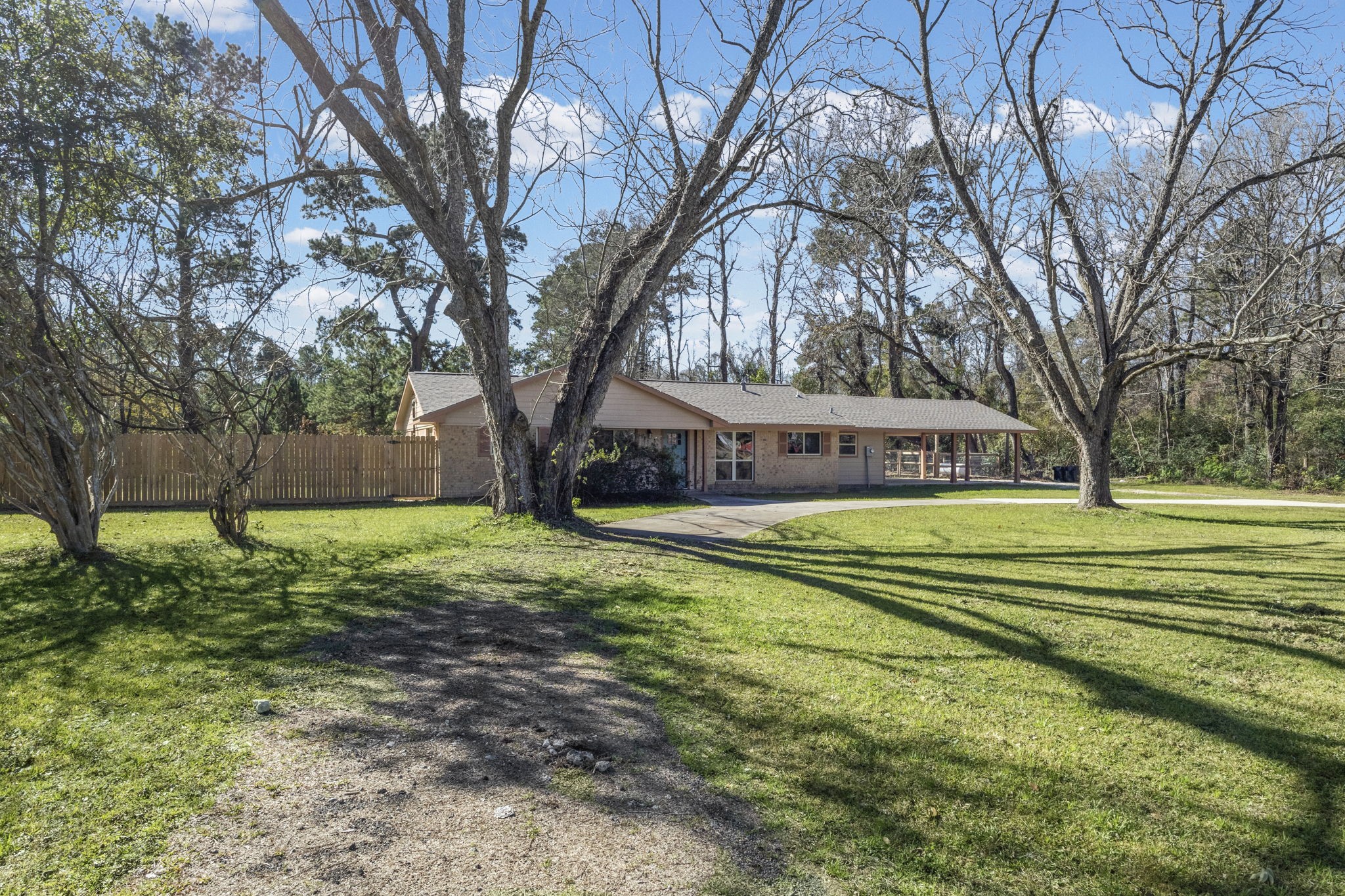44271 Highway 105 Hull, TX 77564 - Photo 3 of 38 a view of a house with a yard