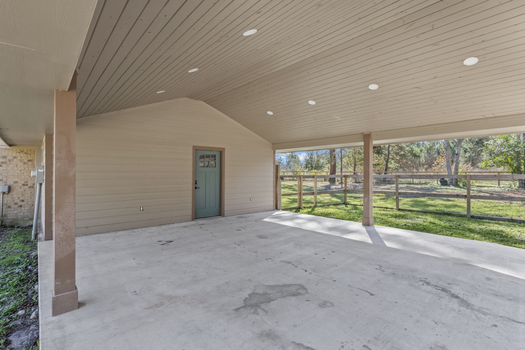 44271 Highway 105 Hull, TX 77564 - Photo 31 of 38 a view of an empty room with a sliding door