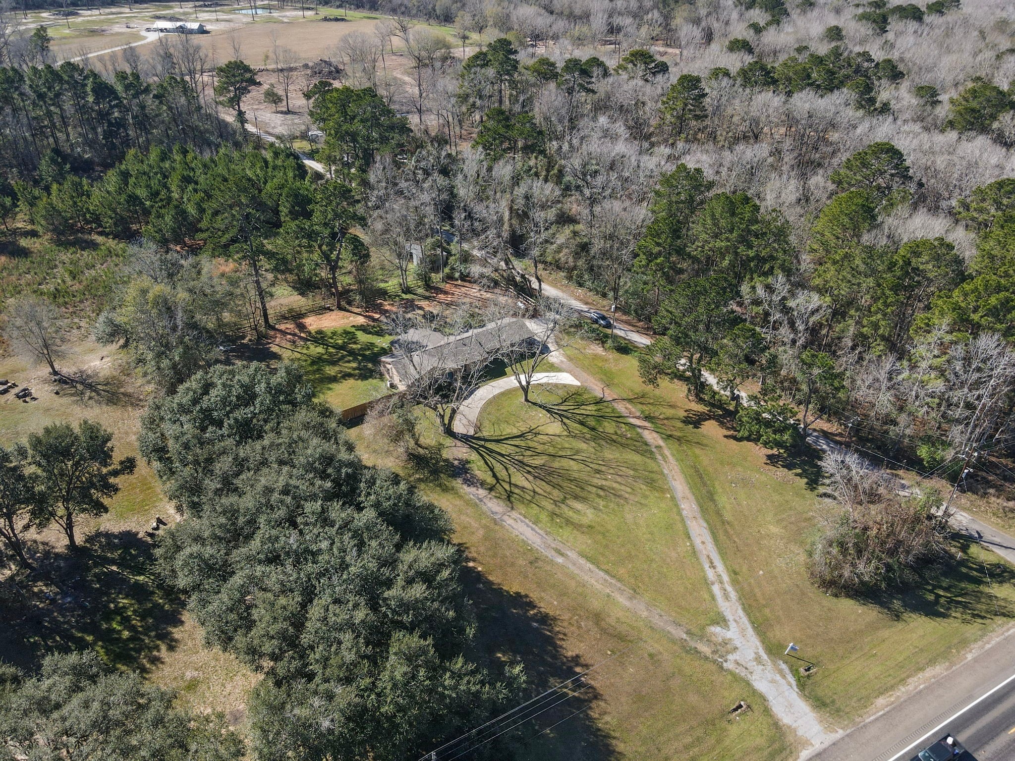 44271 Highway 105 Hull, TX 77564 - Photo 36 of 38 a view of a yard with wooden floor