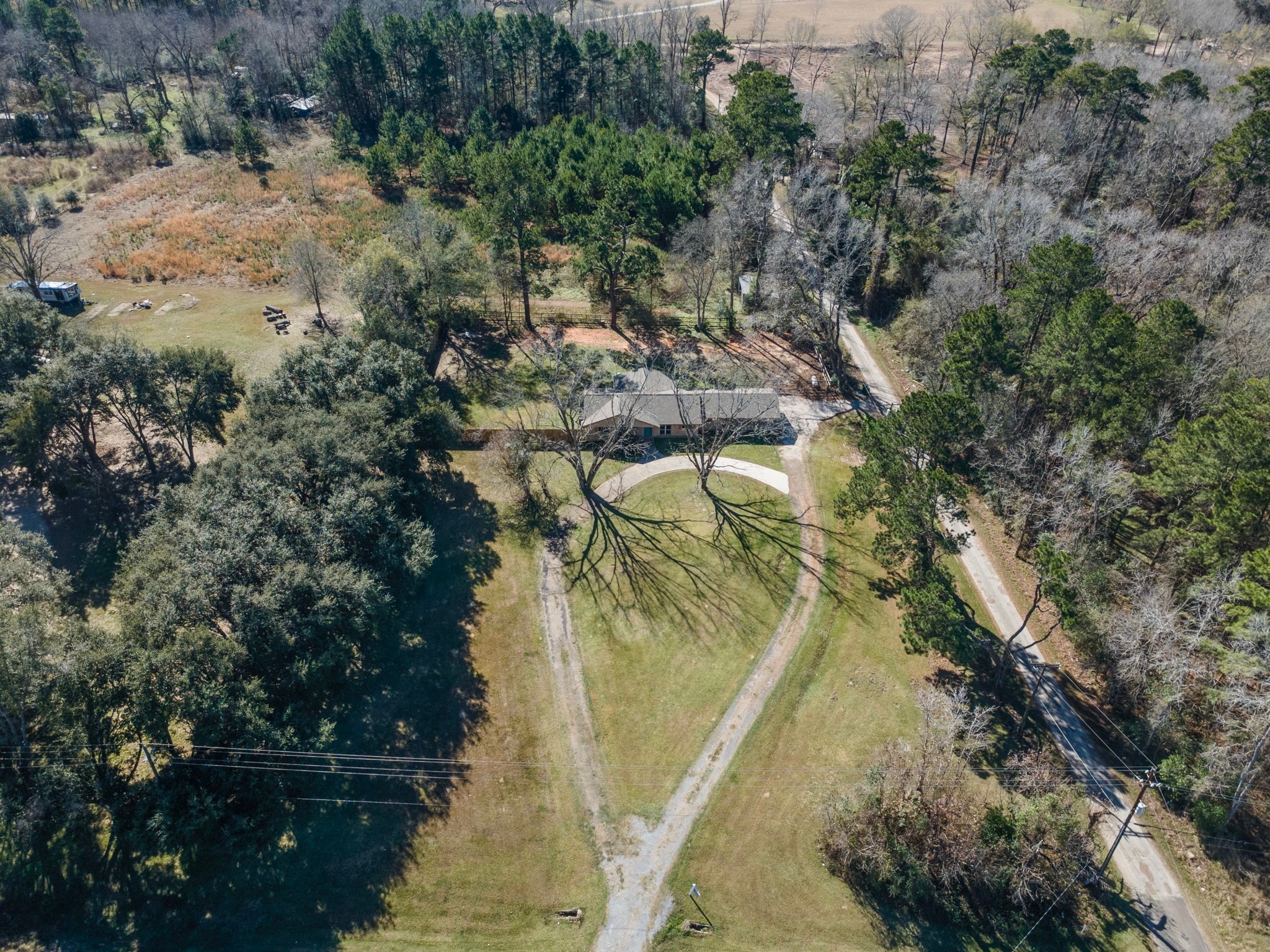 44271 Highway 105 Hull, TX 77564 - Photo 37 of 38 a view of a lake in a forest
