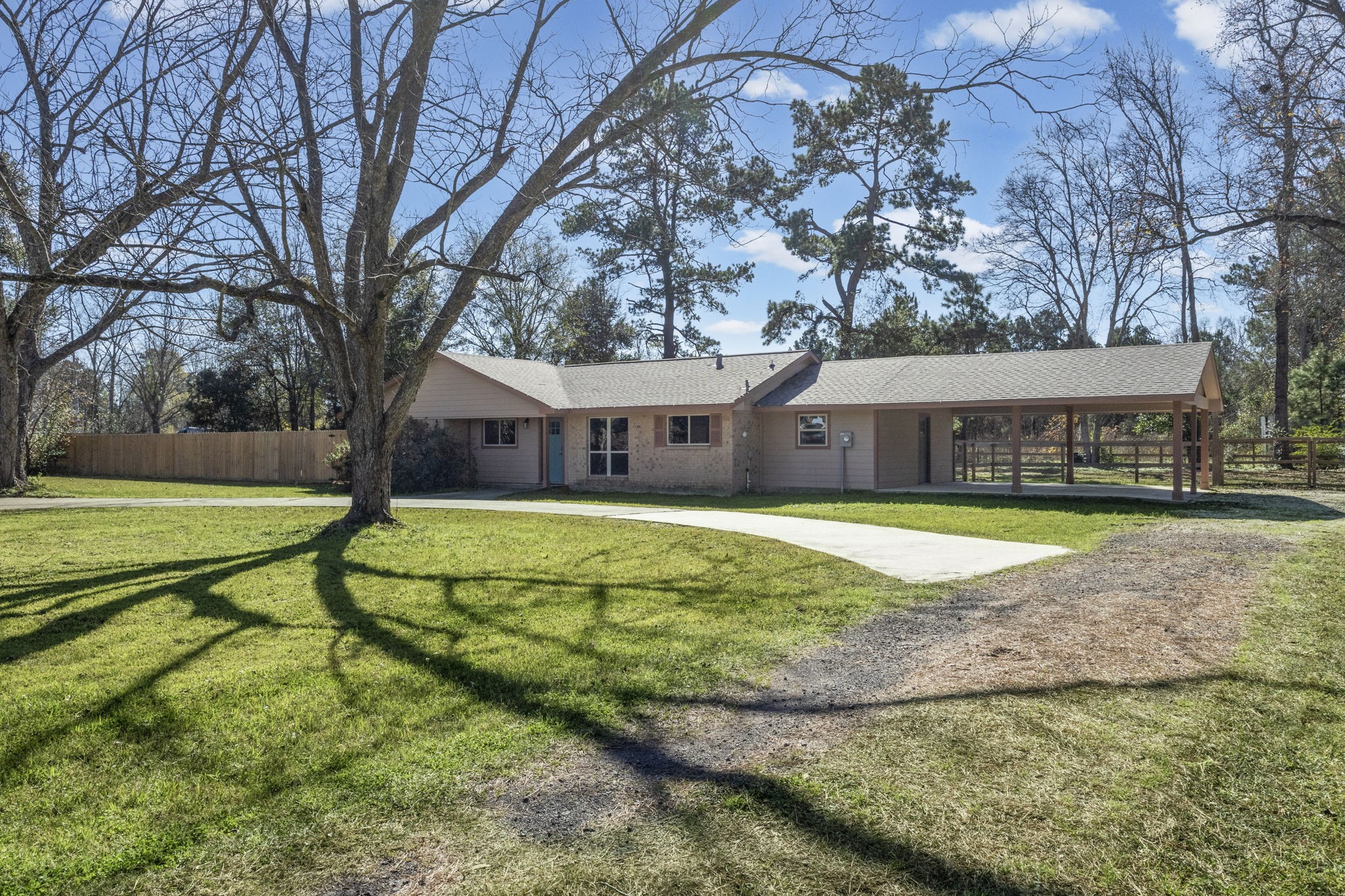 44271 Highway 105 Hull, TX 77564 - Photo 4 of 38 a house with swimming pool in front of it