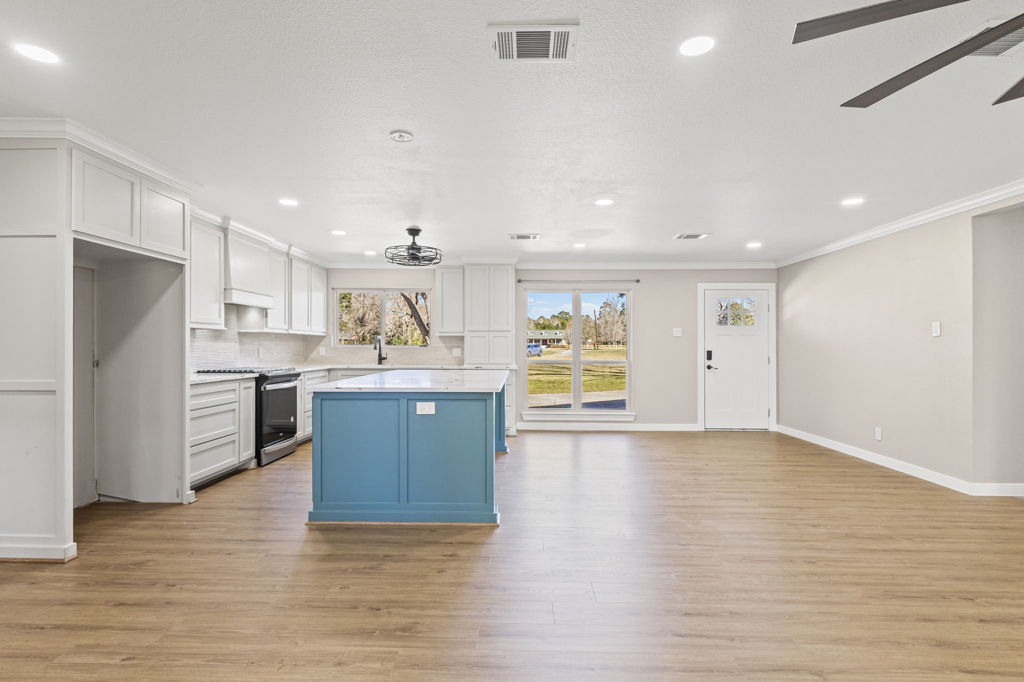 44271 Highway 105 Hull, TX 77564 - Photo 8 of 38 a large kitchen with a refrigerator and a stove top oven
