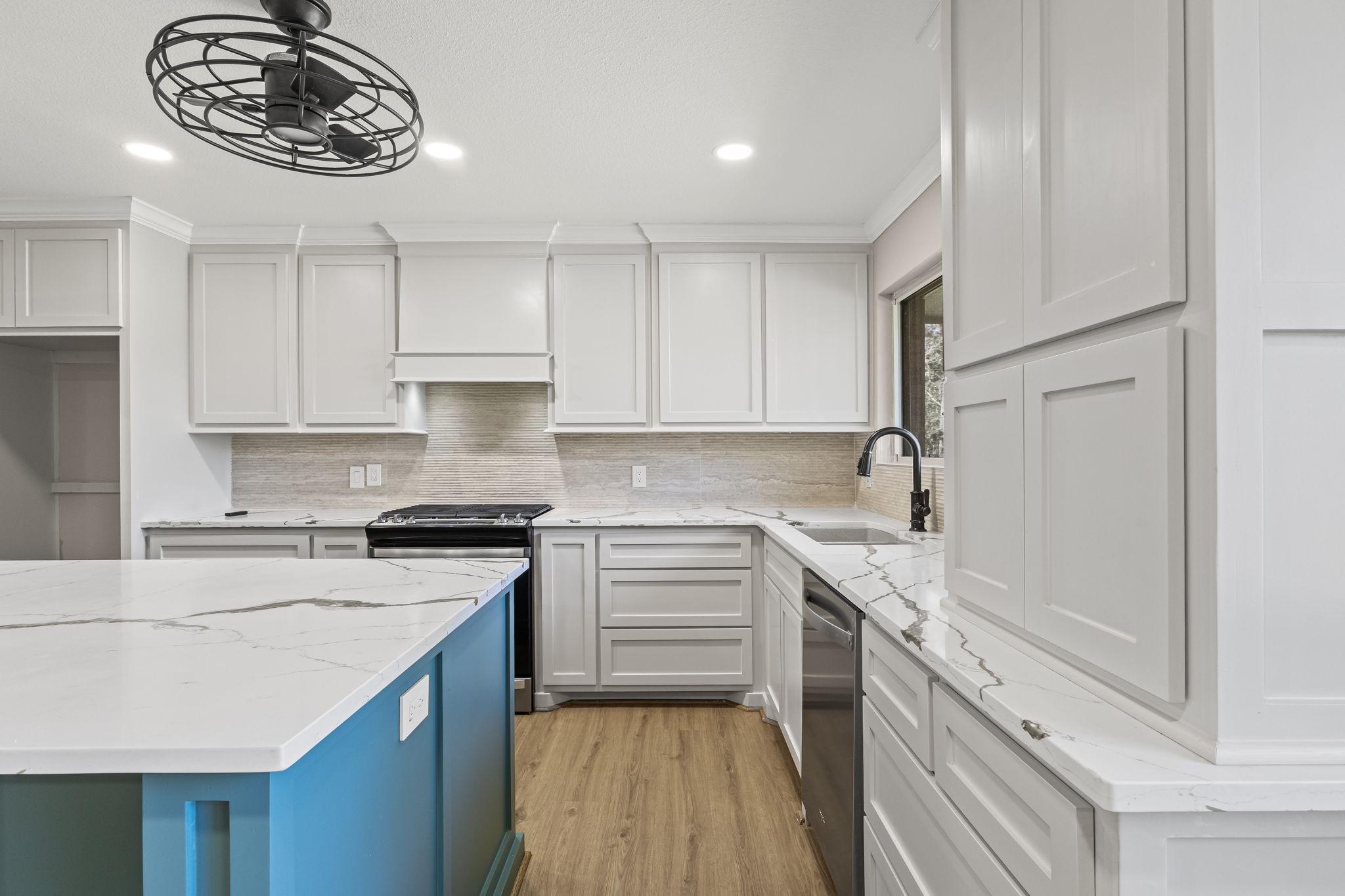44271 Highway 105 Hull, TX 77564 - Photo 9 of 38 a kitchen with a stove oven and a sink