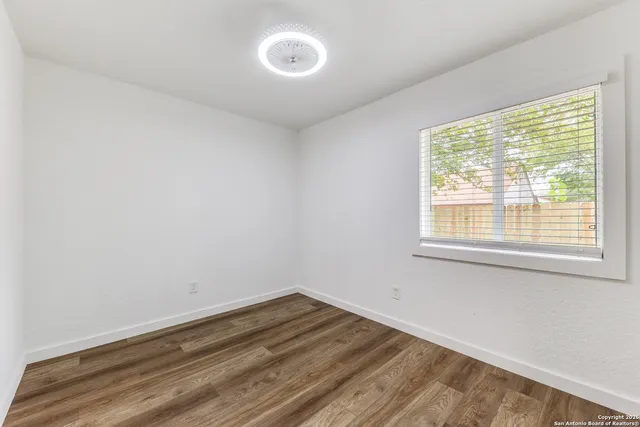 a view of a room that has a window in it