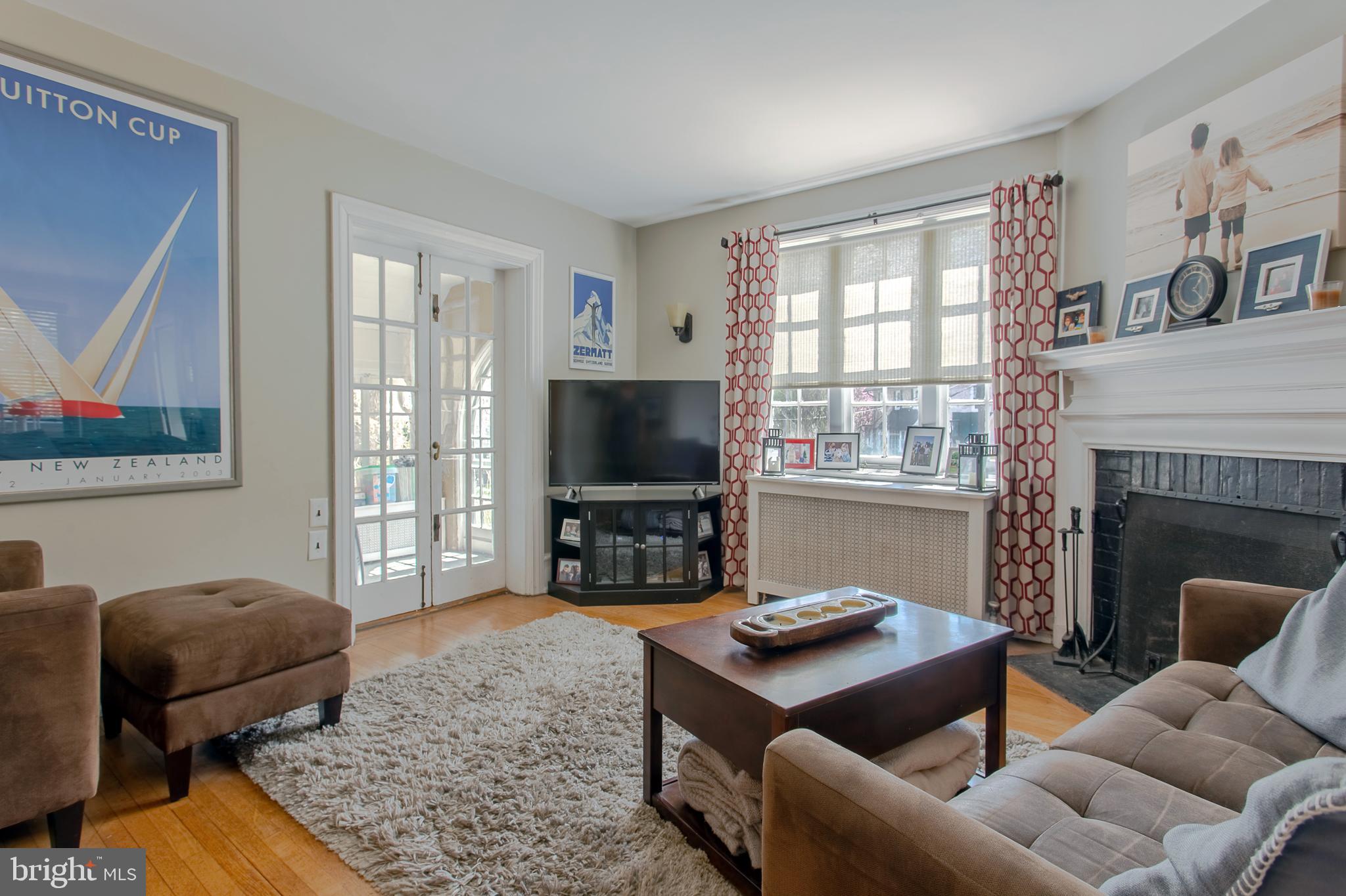 17 Shirley Road Narberth, PA 19072 - Photo 5 of 27 living room with doors leading to sun porch