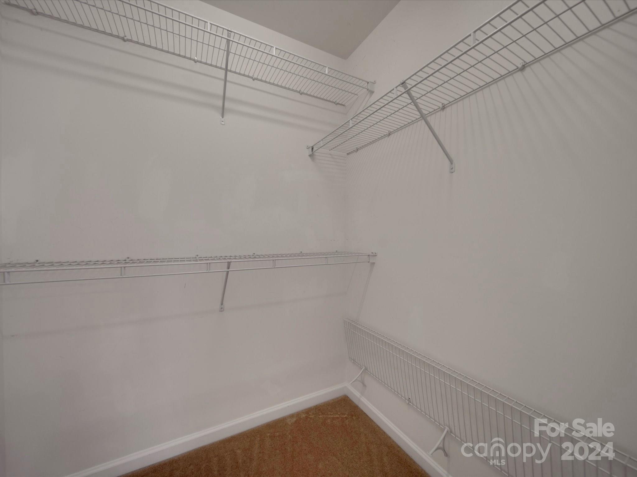 1004 Spanish Moss Road Indian Trail, NC 28079 - Photo 19 of 25 a view of a room with racks on the wall