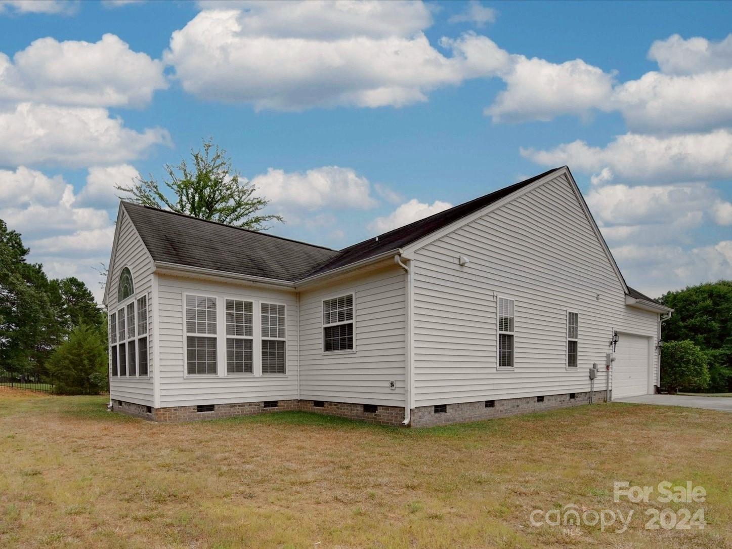 1004 Spanish Moss Road Indian Trail, NC 28079 - Photo 2 of 25 a view of a house with a backyard