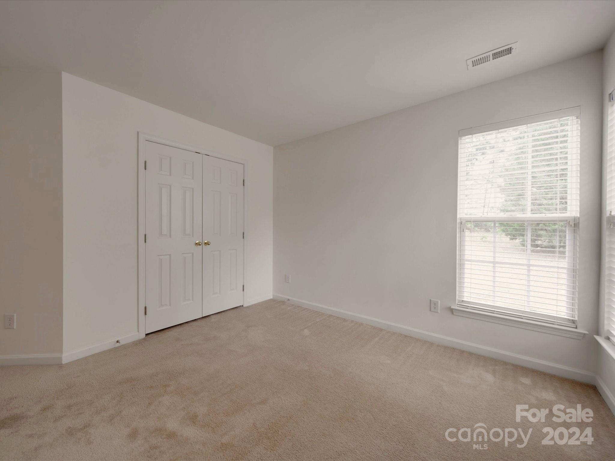 1004 Spanish Moss Road Indian Trail, NC 28079 - Photo 7 of 25 an empty room with windows