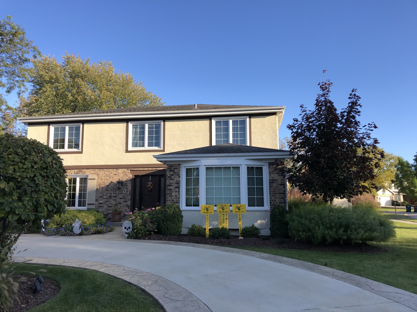 3324 Lake Knoll Drive Northbrook, IL 60062 - Photo 2 of 27 a front view of a house with garden and glass windows