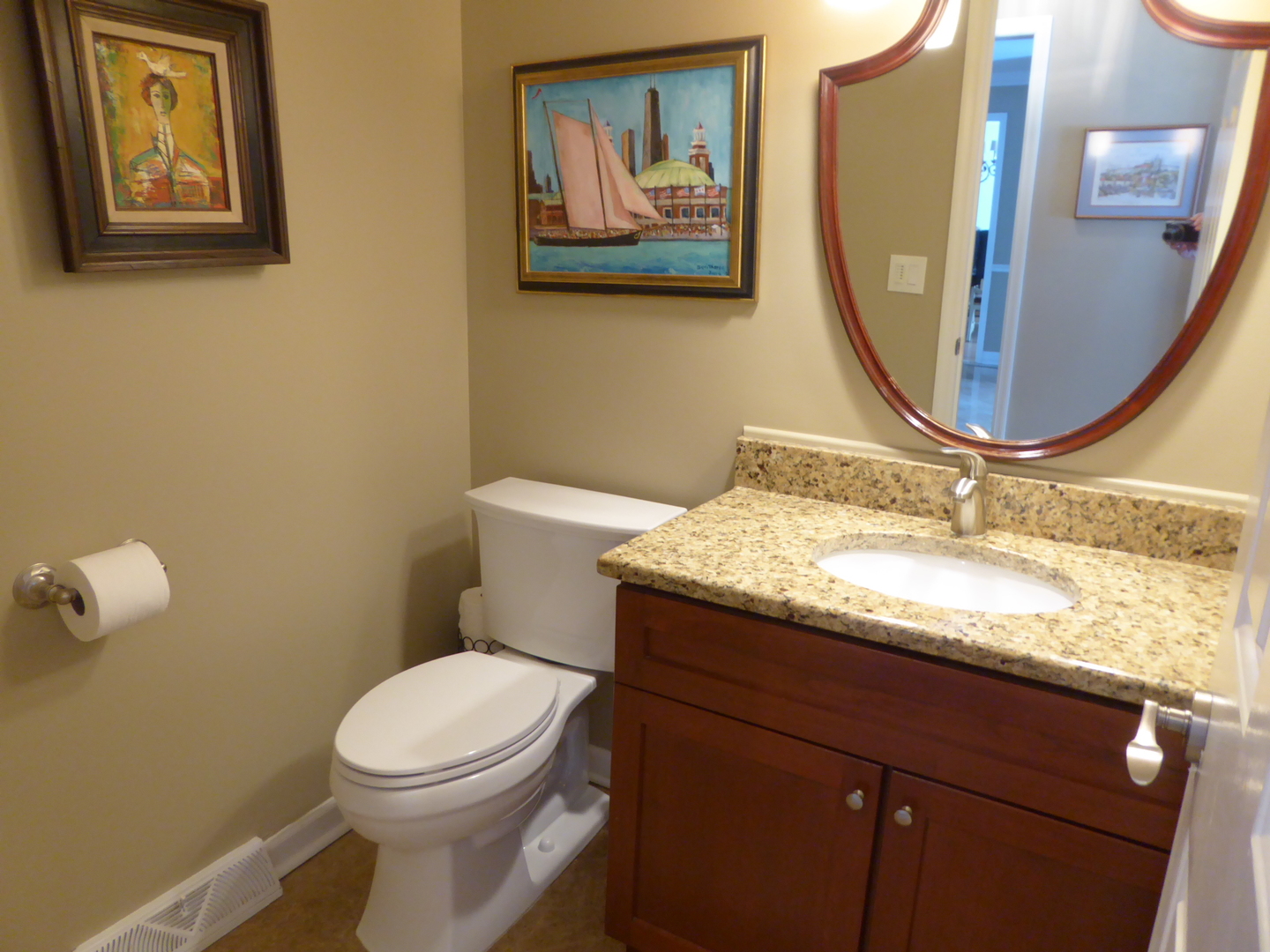 3324 Lake Knoll Drive Northbrook, IL 60062 - Photo 19 of 27 a bathroom with a granite countertop toilet a sink and mirror