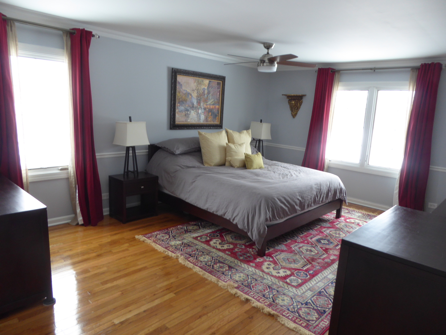 3324 Lake Knoll Drive Northbrook, IL 60062 - Photo 20 of 27 a bedroom with a bed and wooden floor