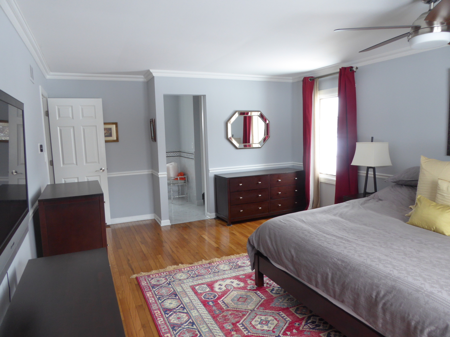 3324 Lake Knoll Drive Northbrook, IL 60062 - Photo 21 of 27 a spacious bedroom with a bed and wooden floor