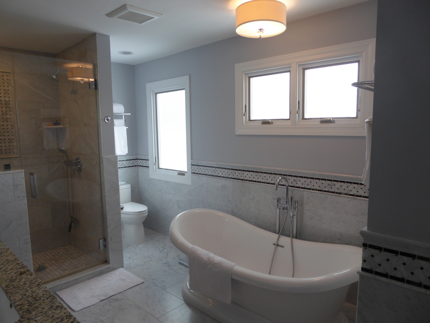 3324 Lake Knoll Drive Northbrook, IL 60062 - Photo 23 of 27 a white bath tub sitting next to a toilet