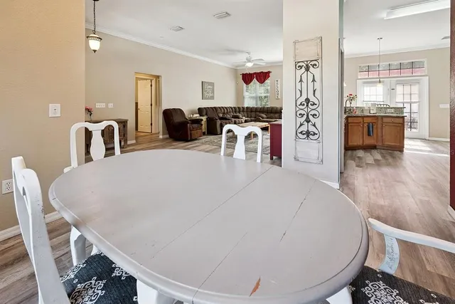 a kitchen with stainless steel appliances granite countertop a stove top oven microwave and refrigerator