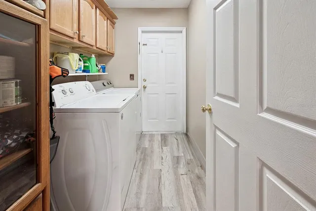 a spacious bedroom with a bed and a flat screen tv
