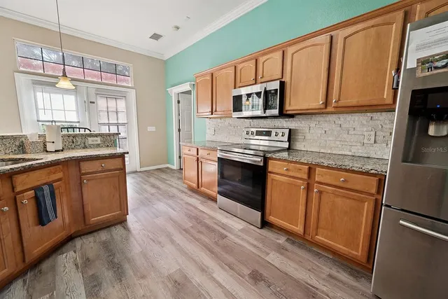 a spacious bedroom with a bed and a window