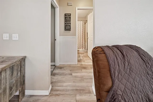 a bathroom with a sink a toilet and shower curtain