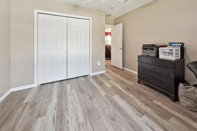 a bedroom with a bed and a tv