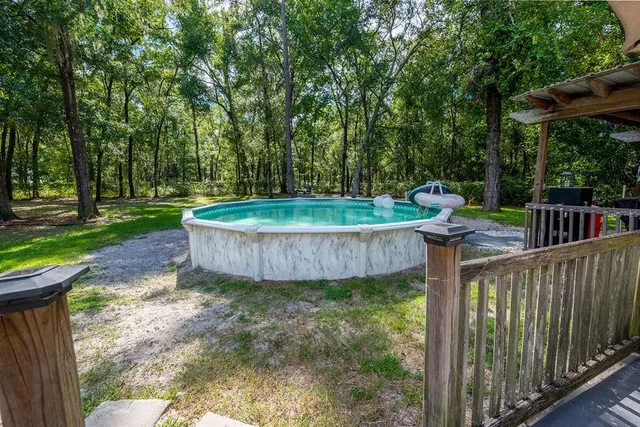 a view of a house with a yard porch and sitting area