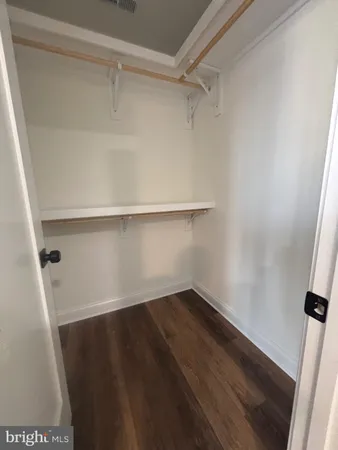 a view of an empty walk in closet
