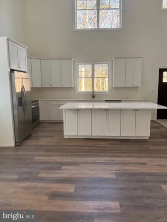 a view with cabinets and wooden floor