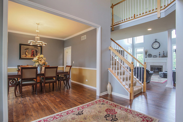 2635 Saltmeadow Road Naperville, IL 60564 - Photo 2 of 25 a view of a dining room with furniture and wooden floor