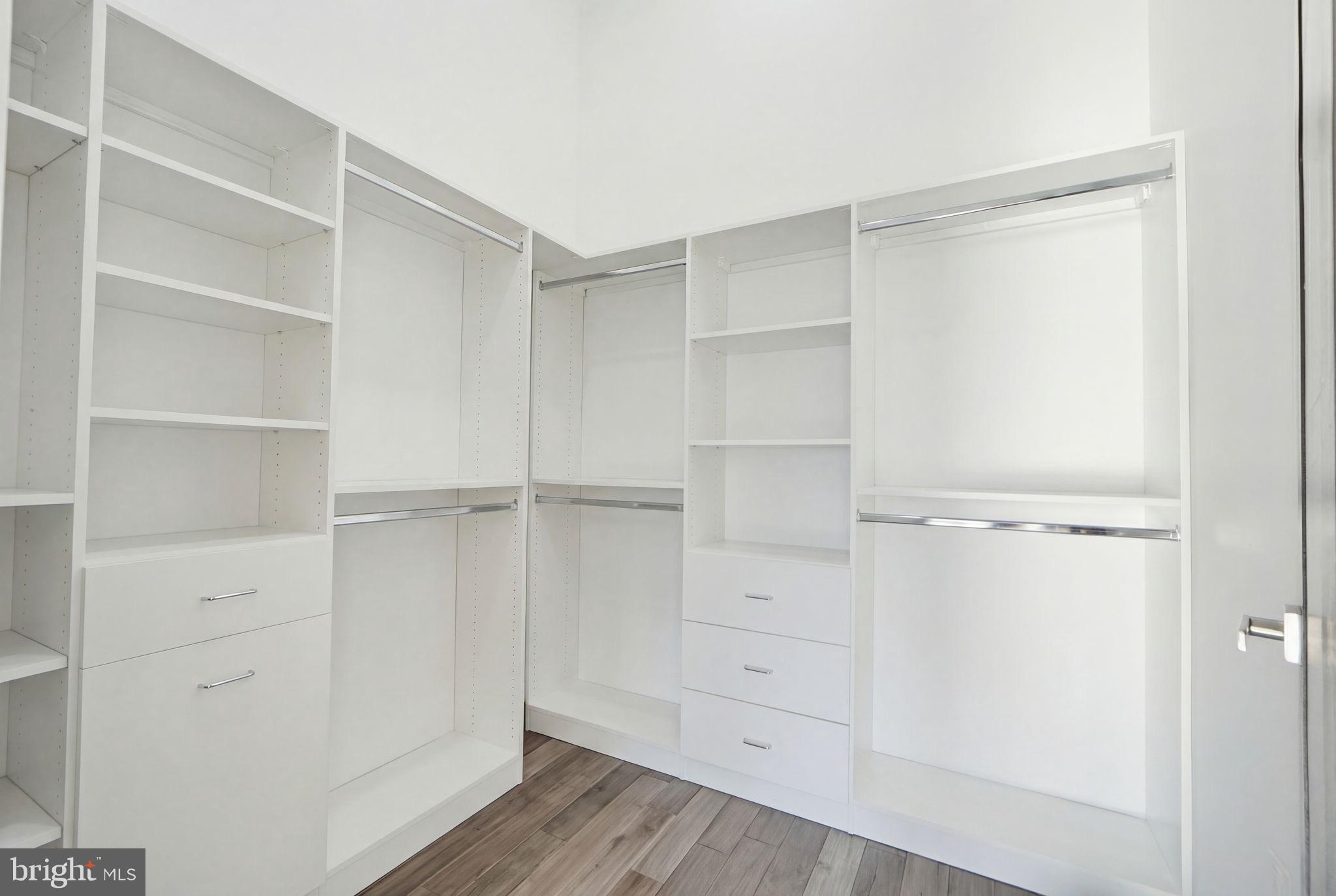 2368 Hunter Mill Road Vienna, VA 22181 - Photo 34 of 74 a view of walk in closet with empty racks
