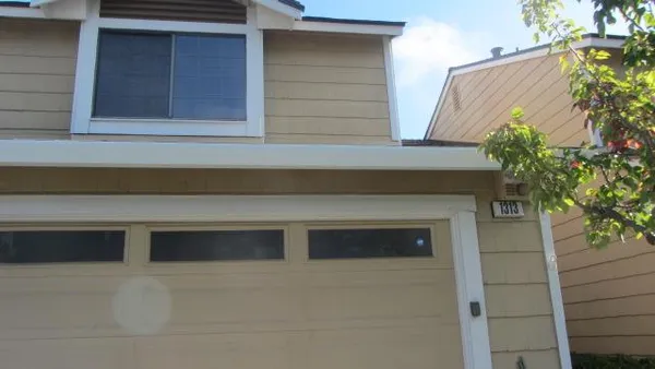 a front view of a house with a garage