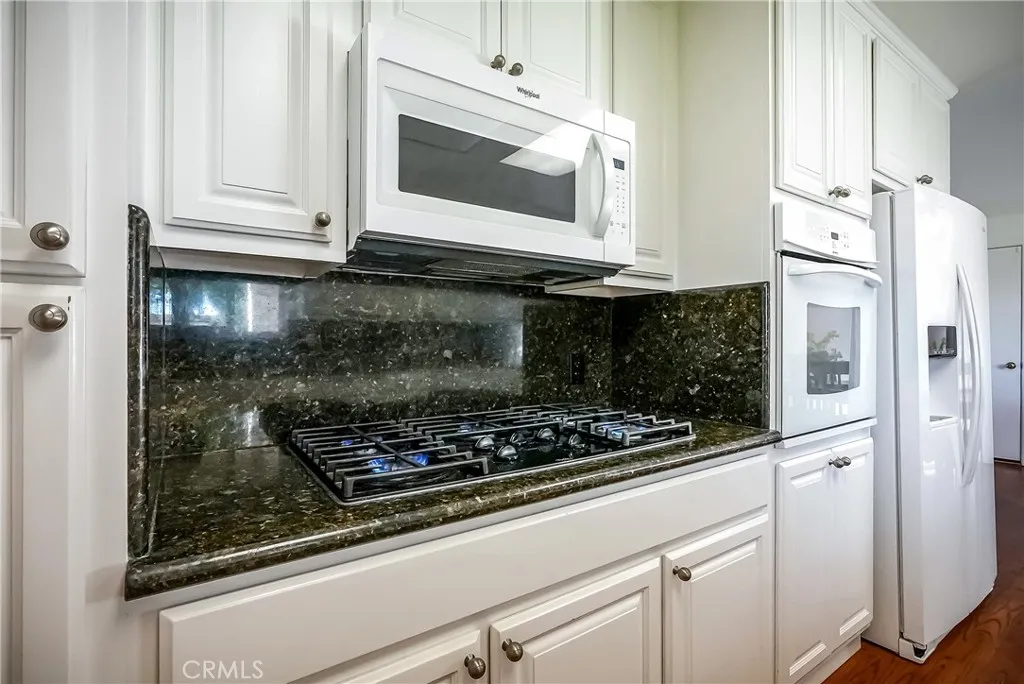 9999 North Shelton Road Linden, CA 95236 - Photo 15 of 75 a kitchen with white cabinets and appliances