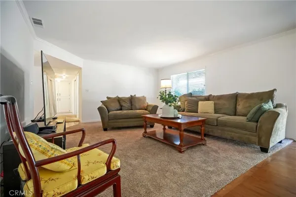 a kitchen with stainless steel appliances granite countertop a refrigerator a sink dishwasher a stove with wooden floor