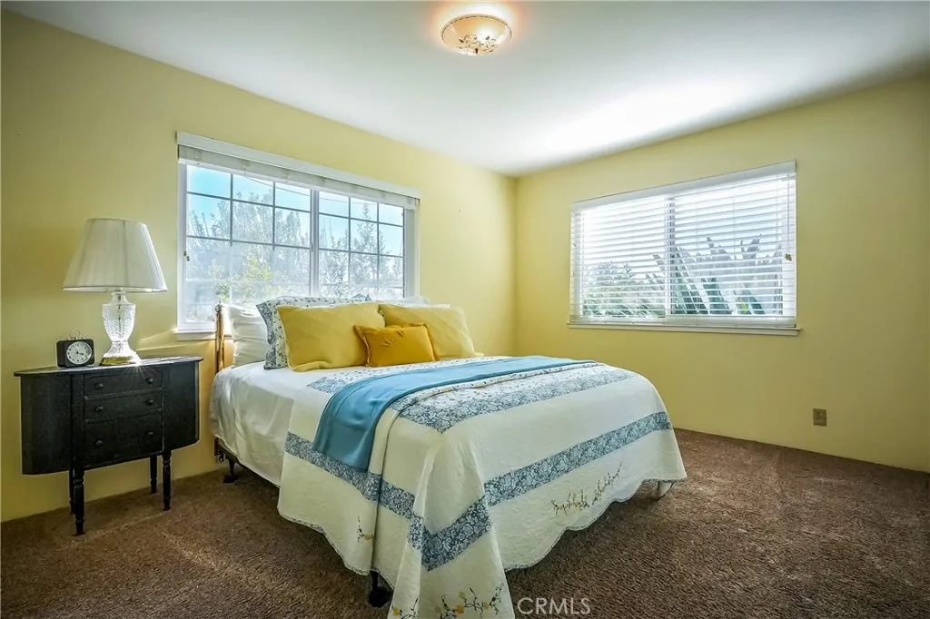 9999 North Shelton Road Linden, CA 95236 - Photo 24 of 75 a bed sitting in a bedroom next to a window