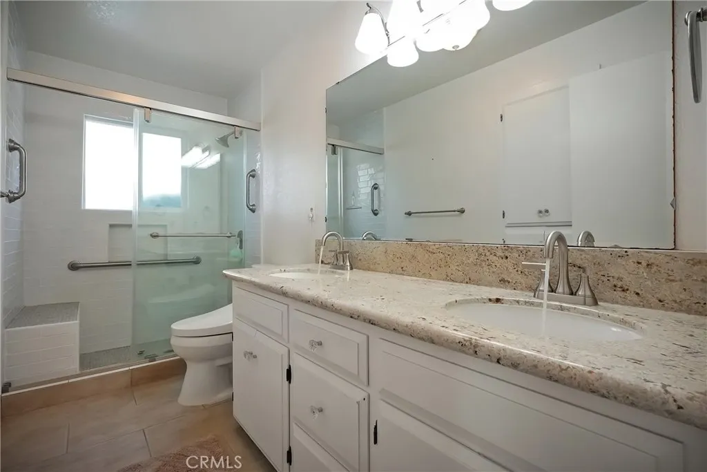 9999 North Shelton Road Linden, CA 95236 - Photo 26 of 75 a bathroom with a granite countertop sink mirror and toilet