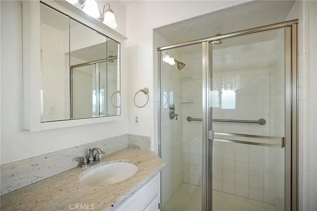 9999 North Shelton Road Linden, CA 95236 - Photo 31 of 75 a bathroom with a granite countertop shower mirror and a sink