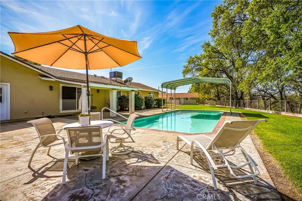 9999 North Shelton Road Linden, CA 95236 - Photo 62 of 75 a view of a swimming pool with a patio