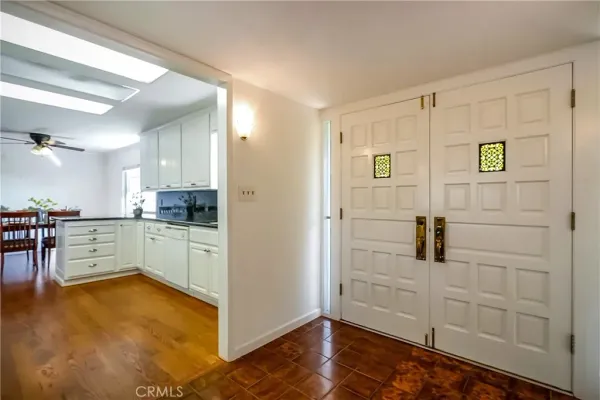 a living room with furniture wooden floor and a window