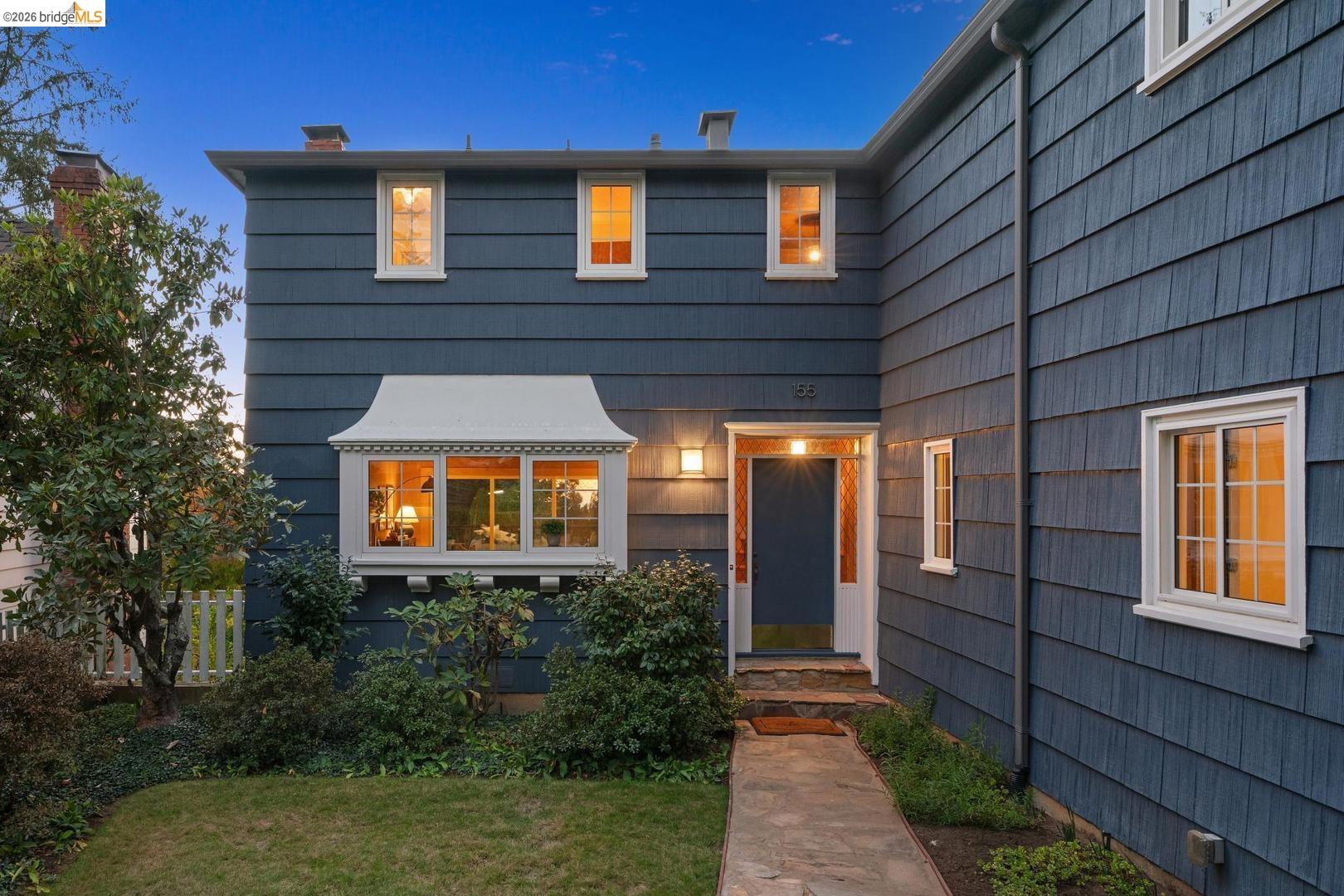 155 Avenida Drive Berkeley, CA 94708 - Photo 1 of 86 Shingle siding exterior with a prominent bay window featuring decorative trim, a walkway leading to a front entry, and multiple white-framed windows