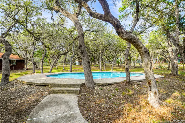 a view of yard with swimming pool