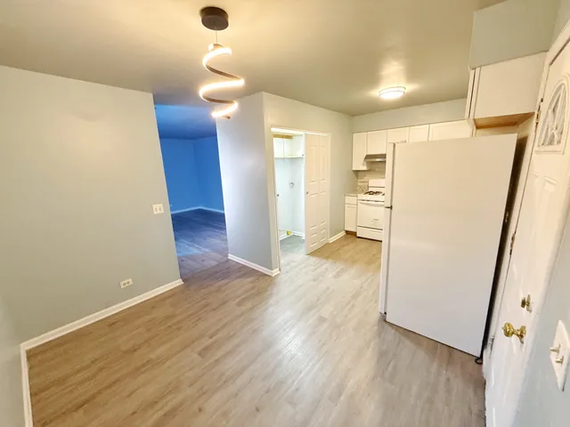 a view of a livingroom with wooden floor