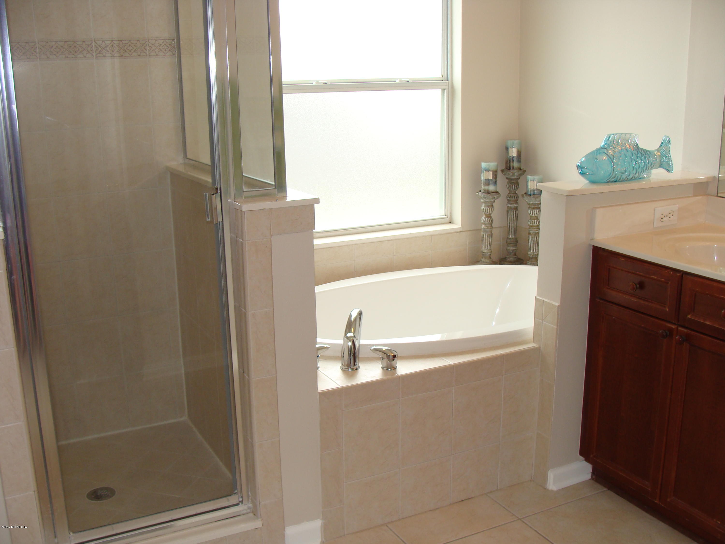 1408 Riva Del Garda Way St. Augustine, FL 32092 - Photo 11 of 54 Master shower and garden tub