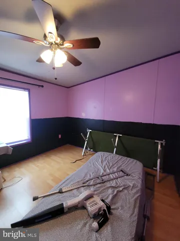 a bed room with a bed and a chandelier