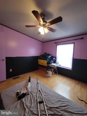 a workspace with furniture and a ceiling fan