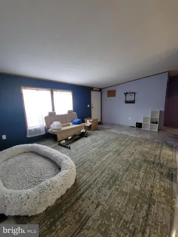 a room with a couch and a fireplace