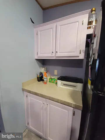 a bathroom with a sink and cabinets